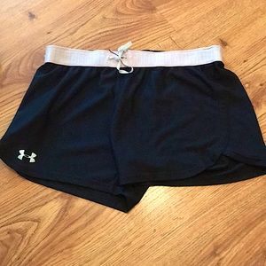Black, pink, and white under armor shorts.